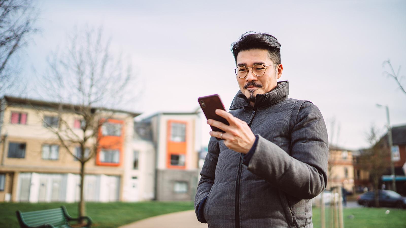 Man using a mobile phone outside