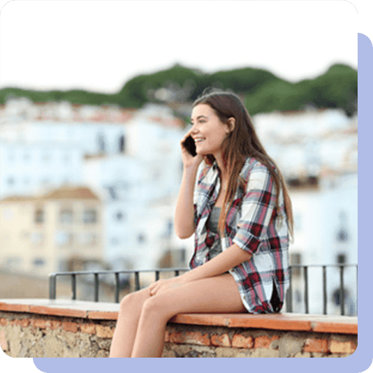 Teenage girl smiling on a phone call