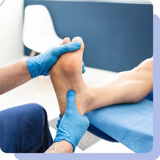 Podiatrist looking at patients foot