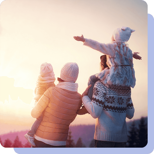 Family watching a winter sunset