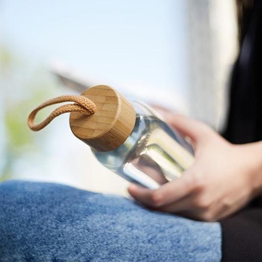 Person holding a reusable water bottle